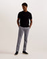 TURNEY-Trousers-These TURNEY chinos blend together smart and casual style for effortlessly wearable trousers. We've kept the comfort of classic chinos with a stretchy cotton blend, adding in a textured finish and cutting a slim fit for a more tailored feel. The details are just as sleek, with a practical hook and zip fly fastening and trendy front flap pocket. Slim fit chinos Textured finish Cotton blend Front flap pocket detail Hook and zip fly fastening Belt loops Welt back pockets with button fastening O
